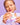 Eine Person mit pastellfarbenen Nägeln öffnet ein Glas INAO by essence Barrier Bae Protection Rich Cream Refill, lächelt vor violetten Fliesen und ist bereit, ihre Hautbarriere zu pflegen.