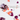Aus einer geöffneten Flasche INAO by essence Clean Skin Community Edition Gummies verschütten sich violette und orangefarbene Gummibärchen auf einer weißen Fläche. Ein Etikett weist auf die Gummibärchen hin: „60 Stück für 1 Monat“ (deutsch).