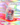 Eine Flasche INAO von Essence Clean Skin Community Edition Gummies mit bunten Kapseln auf einem lebendigen Regenbogenhintergrund. Die Etiketten heben „Neues Design und neuer Geschmack“ und „Gleiche Formel“ hervor.
