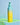 Eine Flasche mit blaugrünem und gelbem Farbverlauf und der Aufschrift „INAO by essence Feel Pure AHA & BHA Exfoliation Cleanser“ steht auf einem leuchtenden Glasregal vor einem hellblauen Hintergrund.