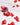 Eine Flasche INAO by essence Hair YEAH! Gummies, rote, sternförmige und mit Biotin & Zink angereicherte Gummies, wird umgekippt, wobei die Gummis auf eine weiße Fläche fallen. Auf dem Etikett steht „60 Stück für 1 Monat“.