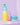 Drei Hautpflegeprodukte vor violettem Hintergrund: eine große Ombre-Flasche, ein kleiner Pumpspender und ein runder Tiegel, alle mit der Marke „INAO by essence“ als Teil des Routine Imperfections Power-Trios gegen.