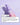 Eine lavendelfarbene Flasche des Good Night Routine Serums von INAO by essence liegt auf einem hellvioletten Untergrund, dahinter befindet sich ein Serum-Abstrich – ideal für die Abendroutine. Das Bild zeigt Gebrauchsanweisung und Produktdetails auf Deutsch.