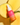 Eine Flasche INAO by essence Light Lover High Protection Serum SPF 50 ruht auf zwei Mangohälften vor gelbem Hintergrund. Die rosa-orange Flasche mit weißem Tropfverschluss bietet hohen Schutz und natürlichen Glow.