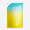 Ein Nachfüllbeutel mit blau-gelbem Farbverlauf und der Aufschrift „INAO by essence Feel Pure AHA & BHA Exfoliation Cleanser Refill“, mit einem weißen Schraubverschluss in der linken oberen Ecke, zur täglichen Reinigung.