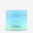 Ein blau-grün gefärbter Behälter mit der Aufschrift „Hydra Soul 24h Hydra Jelly Toner Pads“ von INAO by essence für empfindliche Haut sorgt für intensive Feuchtigkeitsversorgung. Das Produkt ist vor einem schlichten weißen Hintergrund abgebildet.