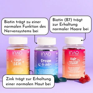 Drei farbenfrohe Flaschen des Supplement Lover Sparset von INAO by essence werden mit Textblasen gezeigt, die die Vorteile für Nerven, Haare und Haut hervorheben. Hair YEAH! Gummies und Clean Skin Gummies sind auf einem lilafarbenen Hintergrund verstreut.